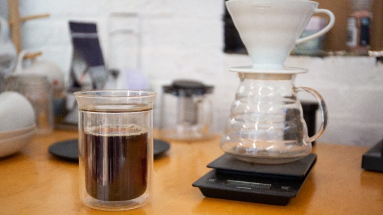 Pour over coffee setup with a glass carafe on a kitchen scale