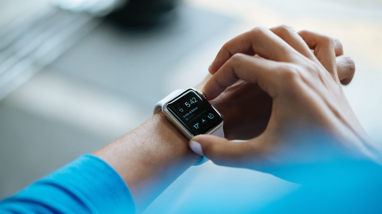 Person checking a smartwatch on their wrist