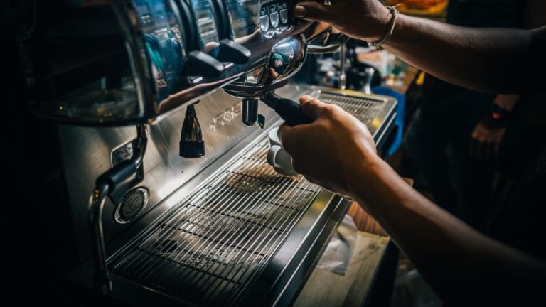 Barista pulling a shot on an espresso machine